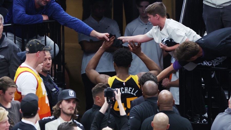Donovan Mitchell high-fives fans at the conclusion of the Utah Jazz season (Photo: Deseret News, Je...