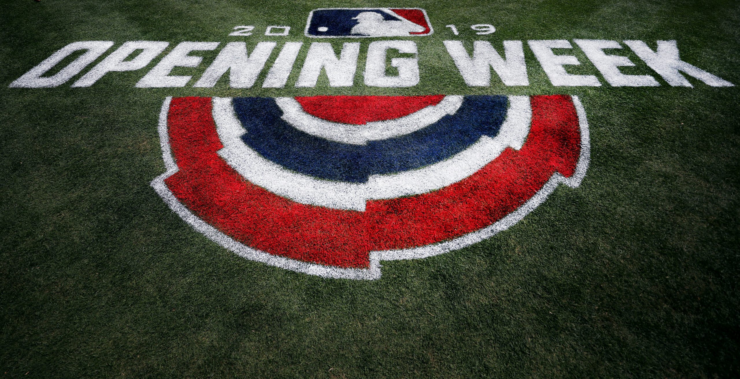 ARLINGTON, TEXAS - MARCH 28: A view of the Opening Week logo on the field prior to the Texas Ranger...
