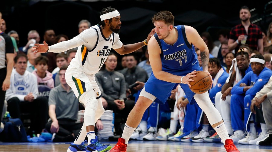 Utah Jazz guard Mike Conley defends Luka Doncic (Photo by Tim Heitman/Getty Images)...