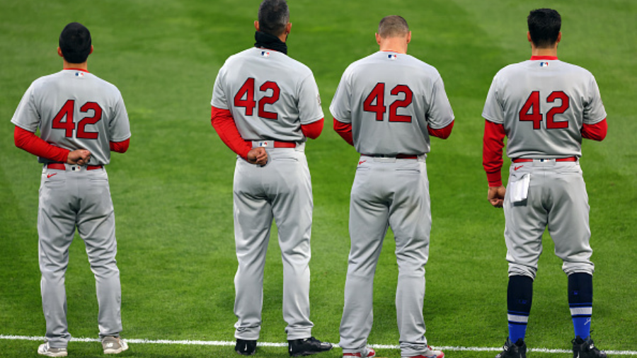 PHILADELPHIA, PA - APRIL 16: St. Louis Cardinals players all wearing the number 42 stand during the...