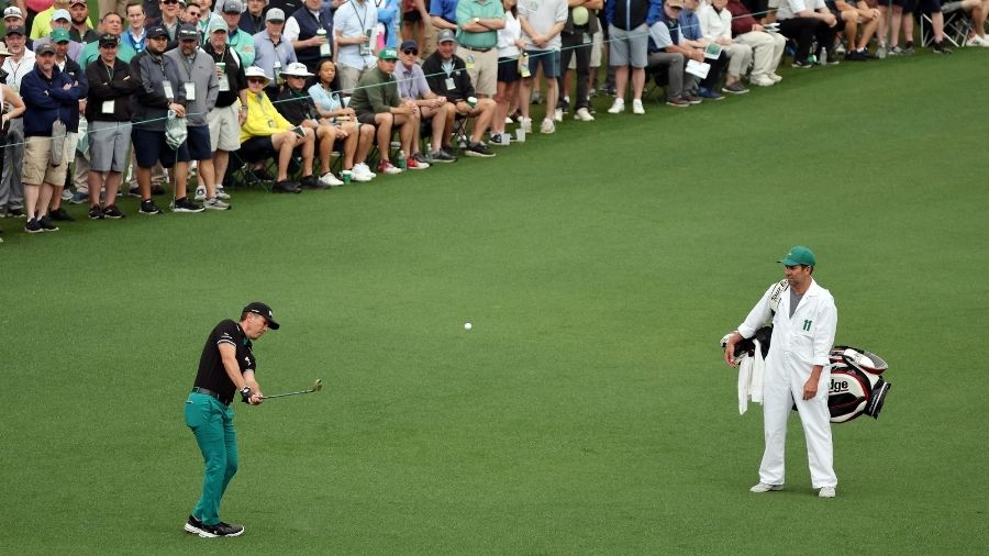 Mike Weir of Canada plays his shot on the second hole during the first round of the Masters at Augu...
