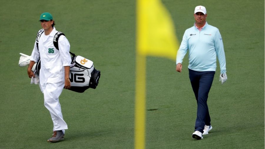 Stewart Cink and caddie Reagan Cink walk across the second hole during the second round of The Mast...