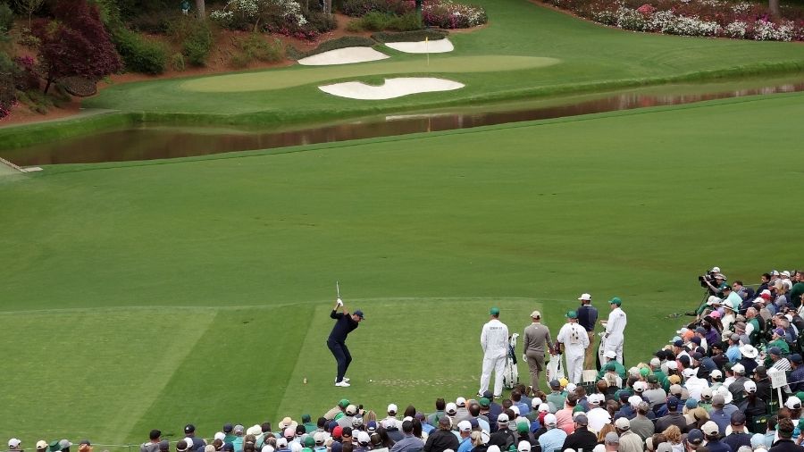Scottie Scheffler plays his shot from the 12th tee during the second round of The Masters at August...