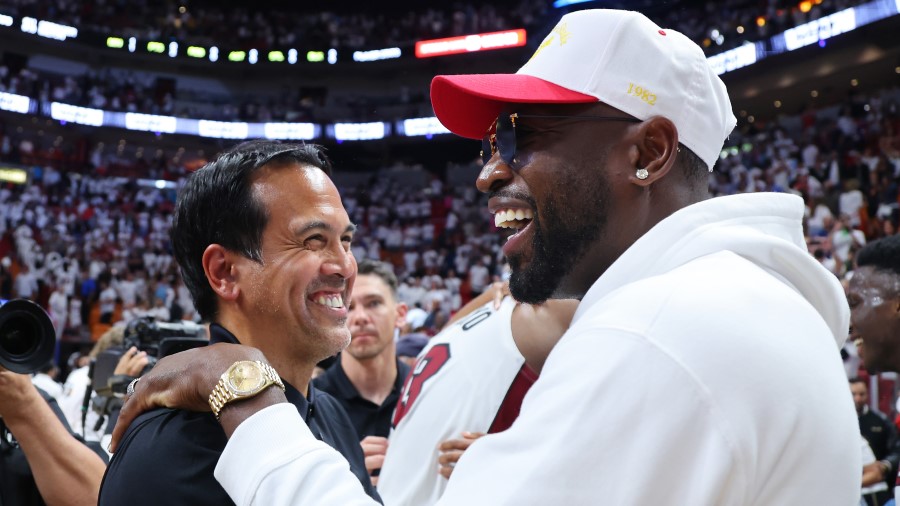 Miami Heat head coach Erik Spoelstra and Utah Jazz part owner Dwyane Wade (Photo by Michael Reaves/...