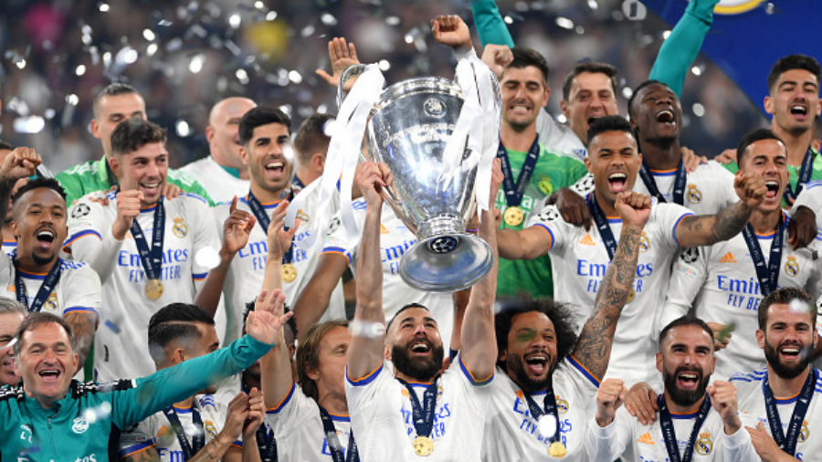 real-madrid-players-hold-champions-league-trophy...