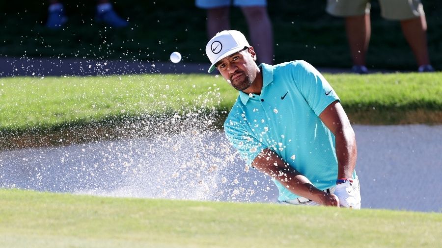 Tony Finau of the United States plays a shot from a bunker on the 16th hole during the first round ...