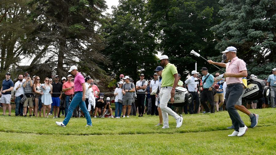 The group of Rory McIlroy of Northern Ireland, Tony Finau of the United States, and Justin Thomas o...