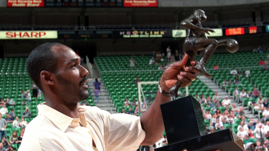 Karl Malone holds his NBA MVP trophy during Karl Malone Fan Appreciation night at the Delta Center....