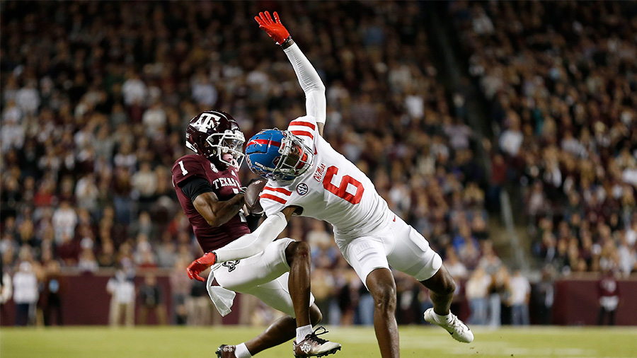 Miles Battle #6 of the Mississippi Rebels breaks up a pass intended for Evan Stewart #1 of the Texa...