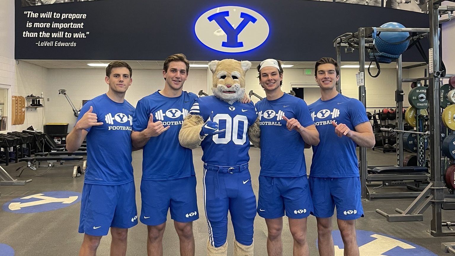 Cosmo the Cougar pictured with Kedon Slovis, Jake Retzlaff, Cade Fennegan and Cole Hagen from BYU F...