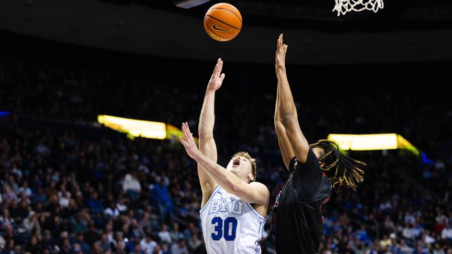 Brigham Young Cougars guard Dallin Hall (30) lays the ball up during a NCAA basketball game at the ...