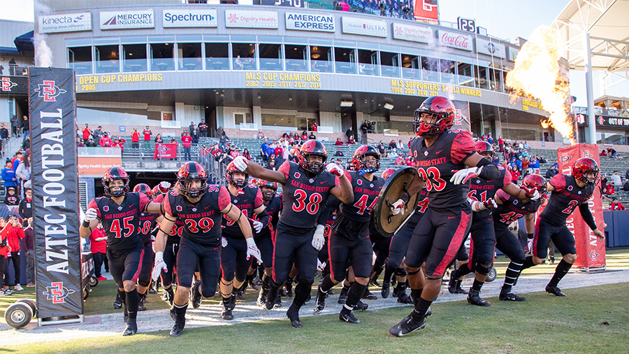 San Diego State football team runs out of tunnel...