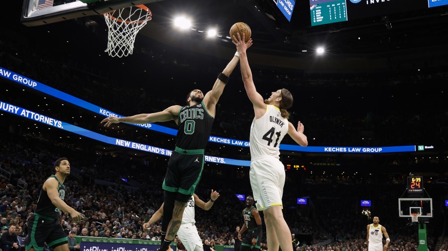 Jayson Tatum #0 of the Boston Celtics battles Kelly Olynyk #41 of the Utah Jazz for a rebound durin...