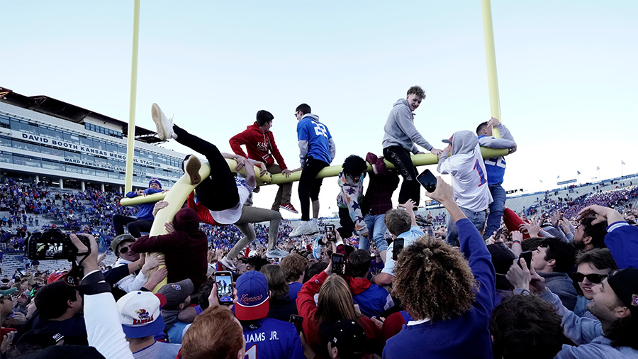 Fans attempt to pull down a goal post after Kansas 37-16 win against the Oklahoma State Cowboys...