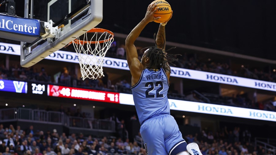 Cam Whitmore #22 of the Villanova Wildcats attempts a dunk against the Boston College Eagles...
