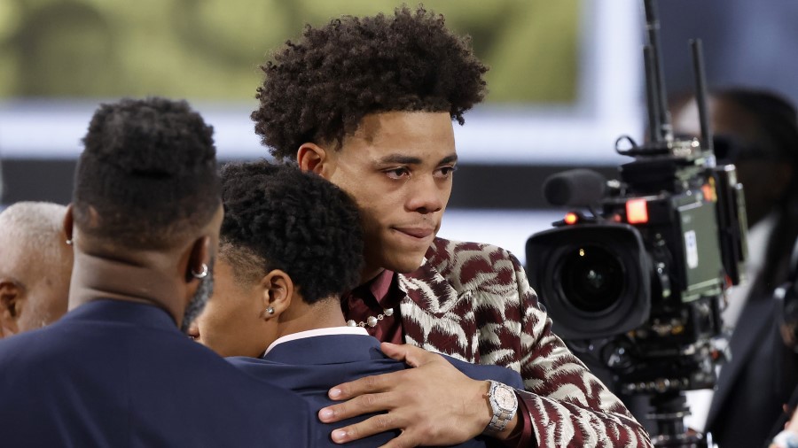 Keyonte George celebrates after being drafted 16th overall pick by the Utah Jazz during the first r...