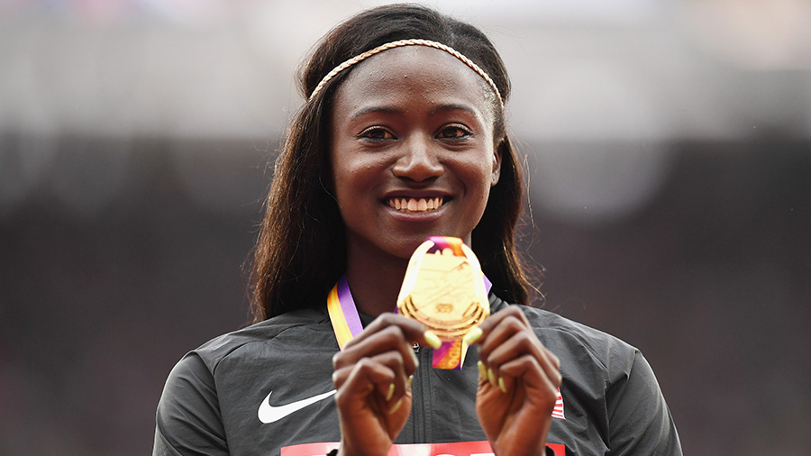 Tori Bowie of the United States poses with the gold medal for the Women's 100 meters during day fou...