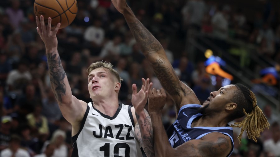 The Utah Jazz’s Luka Samanic drives to the basket...