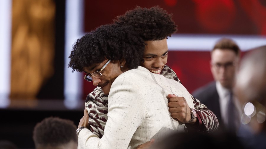 Keyonte George (R) hugs Kobe Bufkin (L) after being drafted 15th overall pick by the Atlanta Hawks ...