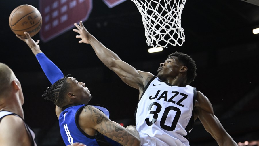Jordan Miller #11 of LA Clippers takes a shot against Ochai Agbaji #30 of Utah Jazz during the thir...