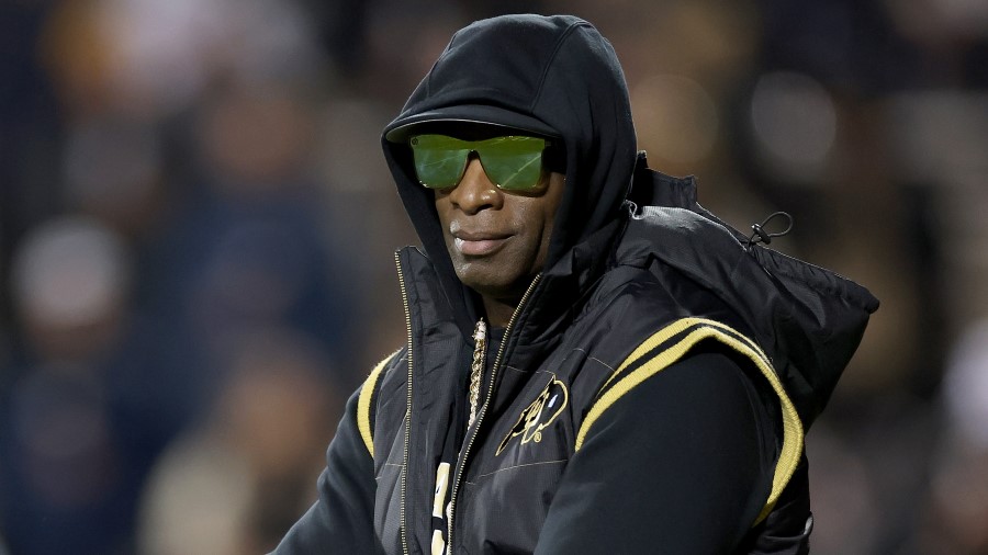 Head coach Deion Sanders of the Colorado Buffaloes walks on the field during pregame against the St...