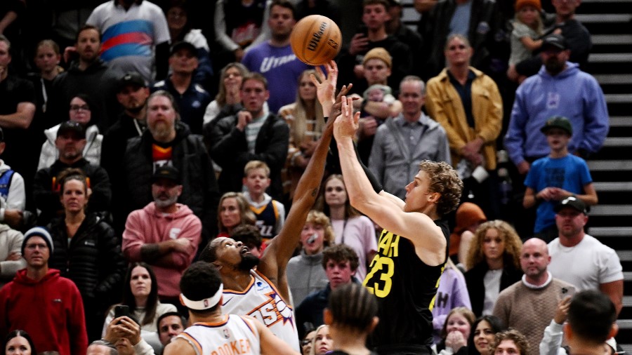 Kevin Durant of the Phoenix Suns challenges a three-point shot by Utah Jazz forward Lauri Markkanen...
