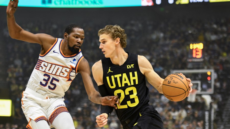 Kevin Durant #35 of the Phoenix Suns derfends Lauri Markkanen #23 of the Utah Jazz