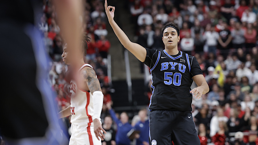 BYU center Aly Khalifa celebrates after making a three-point shot against Texas Tech...