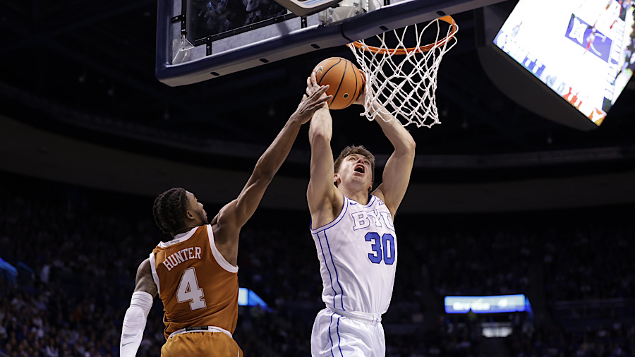 BYU guard Dallin Hall attempts a lay-up against the Texas Longhorns...