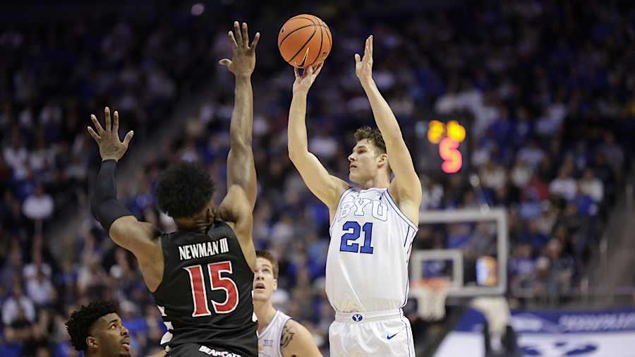 BYU guard Trevin Knell makes a three-point shot against the Cincinnati Bearcats...