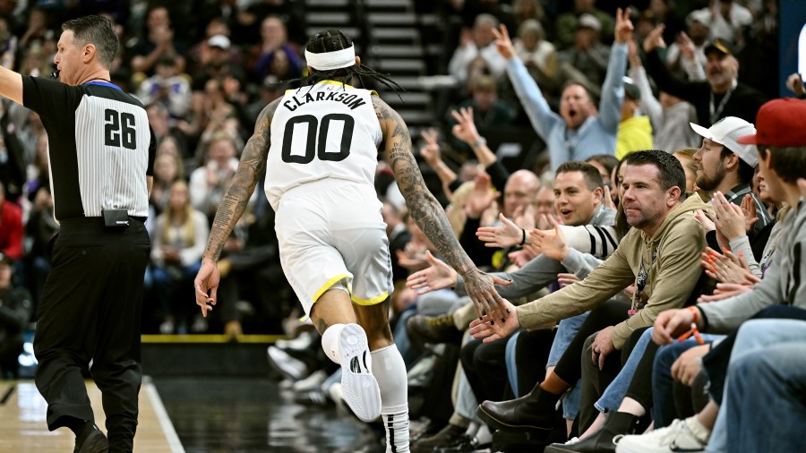 Utah Jazz guard Jordan Clarkson celebrates a made shot with fans...