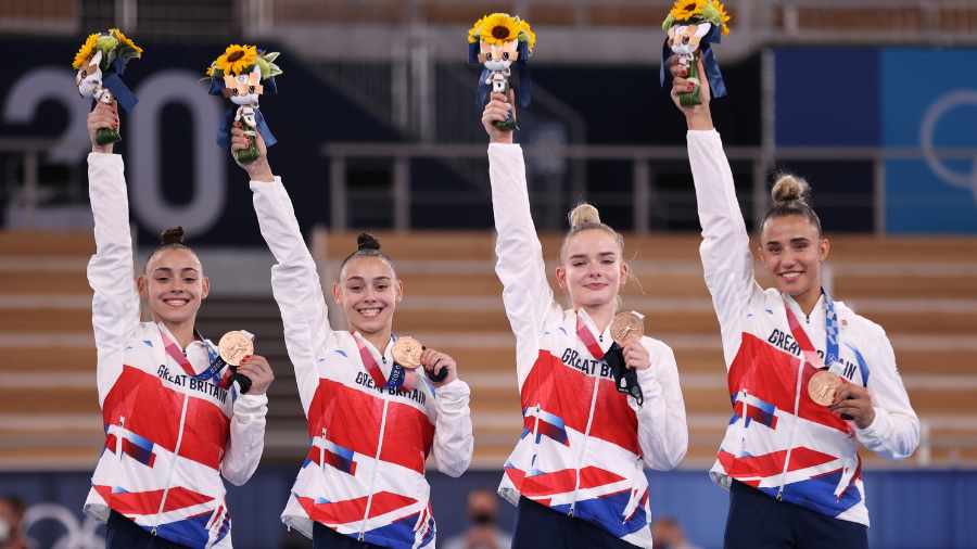 amelie-morgan-far-right-holds-up-bronze-medal-during-tokyo-olympics-with-team-great-britain-teammat...