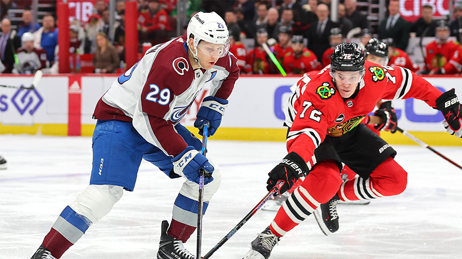 CHICAGO, ILLINOIS - FEBRUARY 29: Nathan MacKinnon #29 of the Colorado Avalanche and Alex Vlasic #72...