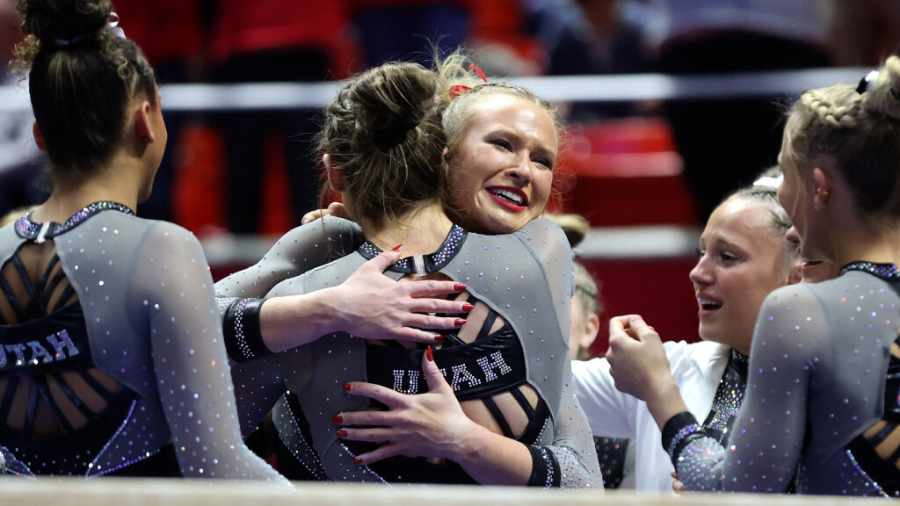 abby-paulson-is-hugged-after-her-beam-routine-by-teammates-on-senior-night-2024...