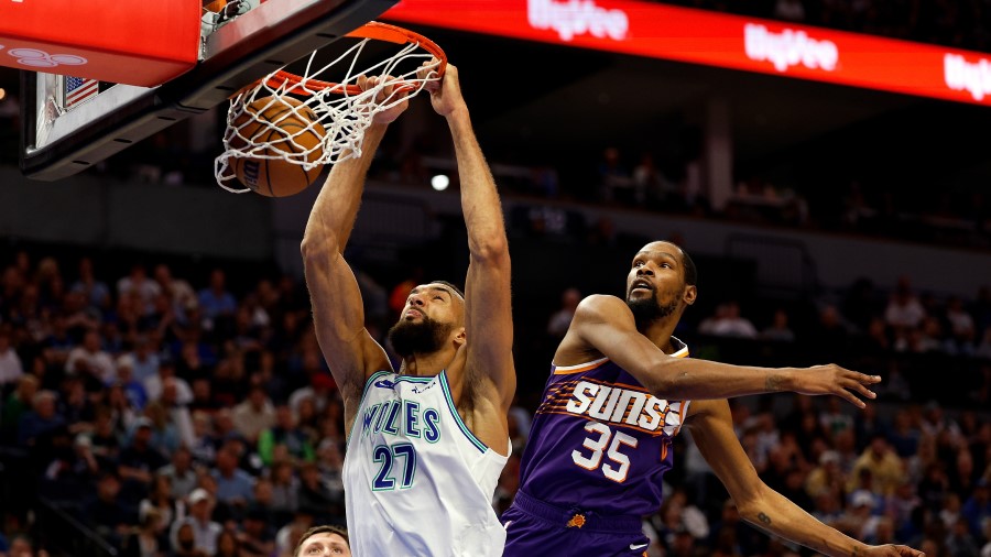 Rudy Gobert #27 of the Minnesota Timberwolves dunks the ball against Kevin Durant #35 of the Phoeni...
