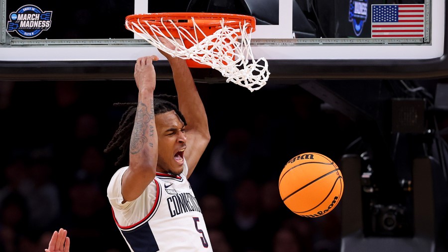 Stephon Castle #5 of the Connecticut Huskies dunks the ball...