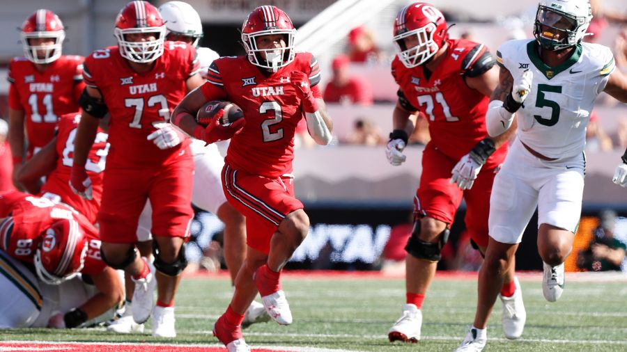 SALT LAKE CITY, UT - SEPTEMBER 7: Micah Bernard #2 of the Utah Utes rushes the ball against Garmon ...