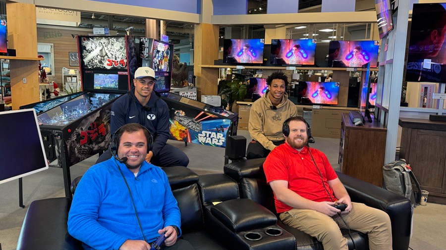 Mitch Harper and Steve Bartle of KSL Sports play College Football 25 with Crew Wakely (BYU) and Mic...